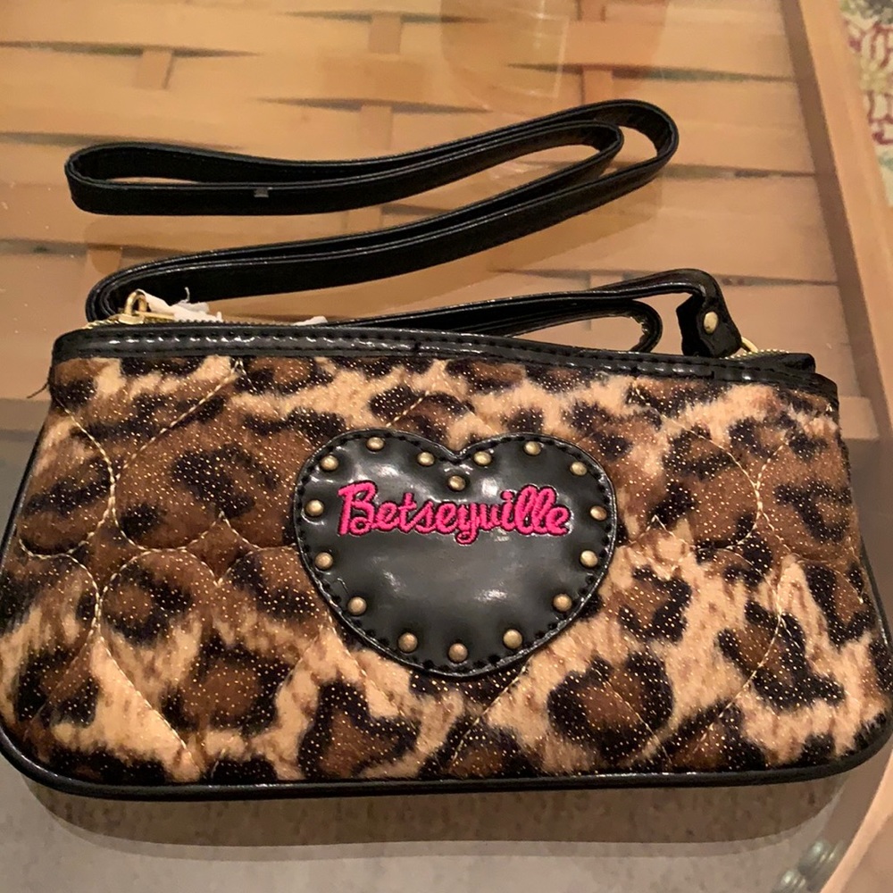 Betsey Johnson mini cheetah print purse. About 3 inches by 7 inches.